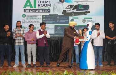An AI robot presenting a memento to the Governor during a live demonstration at the “AI Theme Room” inauguration ceremony at Lok Bhavan.