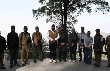 The Governor with attendees during a bird-watching session at the Lok Bhavan Golf Course area.