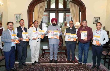 The Governor launching the study material for the ‘Assistant Homestay Manager’ course, developed by the Uttarakhand Open University, at Lok Bhavan.