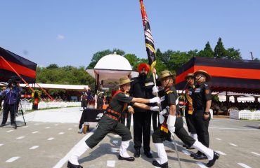 The Governor with Army personnel, alongside the Regimental Flag, during the grand Attestation Parade of the 7th batch of Agniveers of the Assam Regiment, held at the Assam Regimental Centre in Shillong.