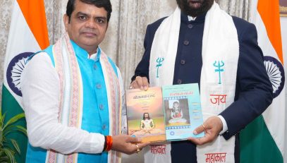 Prof. Shiv Shankar Mishra, presenting a book to the Governor.