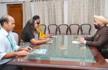 Regional Passport Officer, Dehradun, Smt. Malvika Priyadarshini, Senior Superintendent Shri Tarendra Singh, and Junior Translation Officer Shri Hivam Verma, interacting with the Governor.