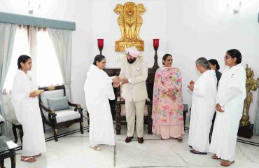 Sisters from the Prajapita Brahma Kumaris Ishwariya Vishwavidyalaya tying rakhi on the Governor during the program held at Lok Bhavan on the auspicious occasion of Raksha Bandhan.