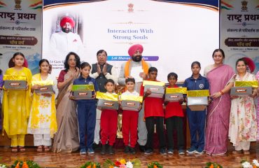 The Governor distributing gifts and nutritious food to TB patients, persons with disabilities, and orphaned children, at an event held at Lok Bhavan.