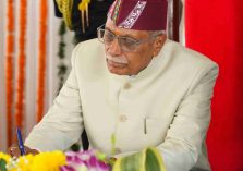 Governor Dr. Dhal Singh Bisen signing documents upon assuming charge as the Governor of Uttarakhand at a ceremony held at Lok Bhavan.