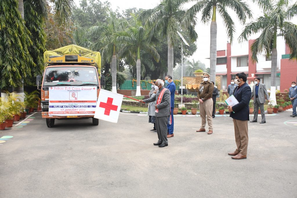 Haryana Governor Shri Bandaru Dattatraya flagging off two trucks containing 4000 hygiene kits prepared by the Indian Red Cross Society