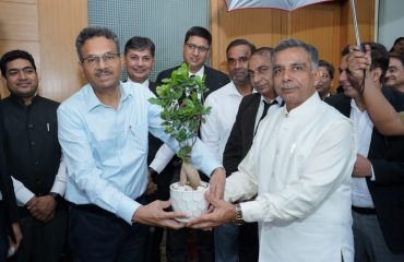 Sh. Sanjay Hooda, Director, Prosecution Department, Haryana presenting flower pot to Worthy Additional Chief secretary to Government, Haryana Administrative of Justice Department, Haryana