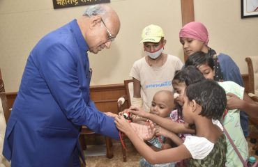 30.08.2023: Cancer survivor girls tie Rakhi to Governor