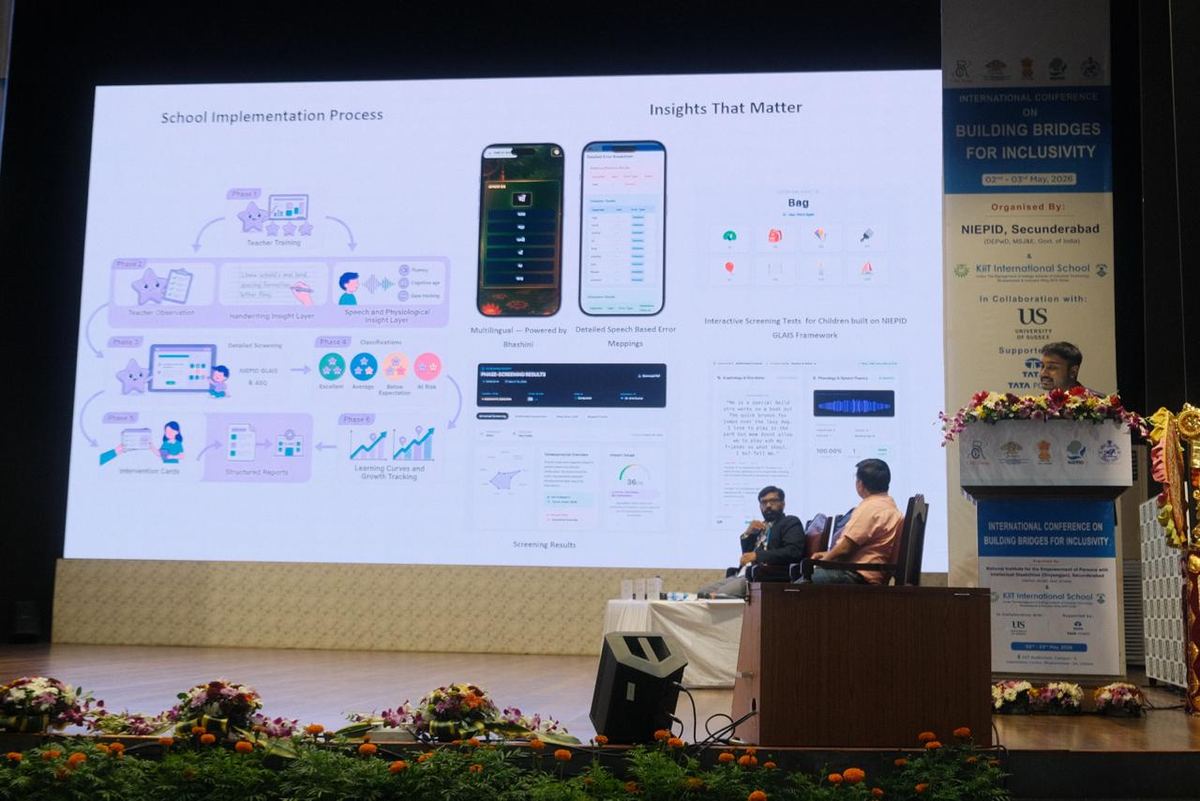 Jiveesha presented on stage at the International Conference on Building Bridges for Inclusivity, with the school implementation process on screen