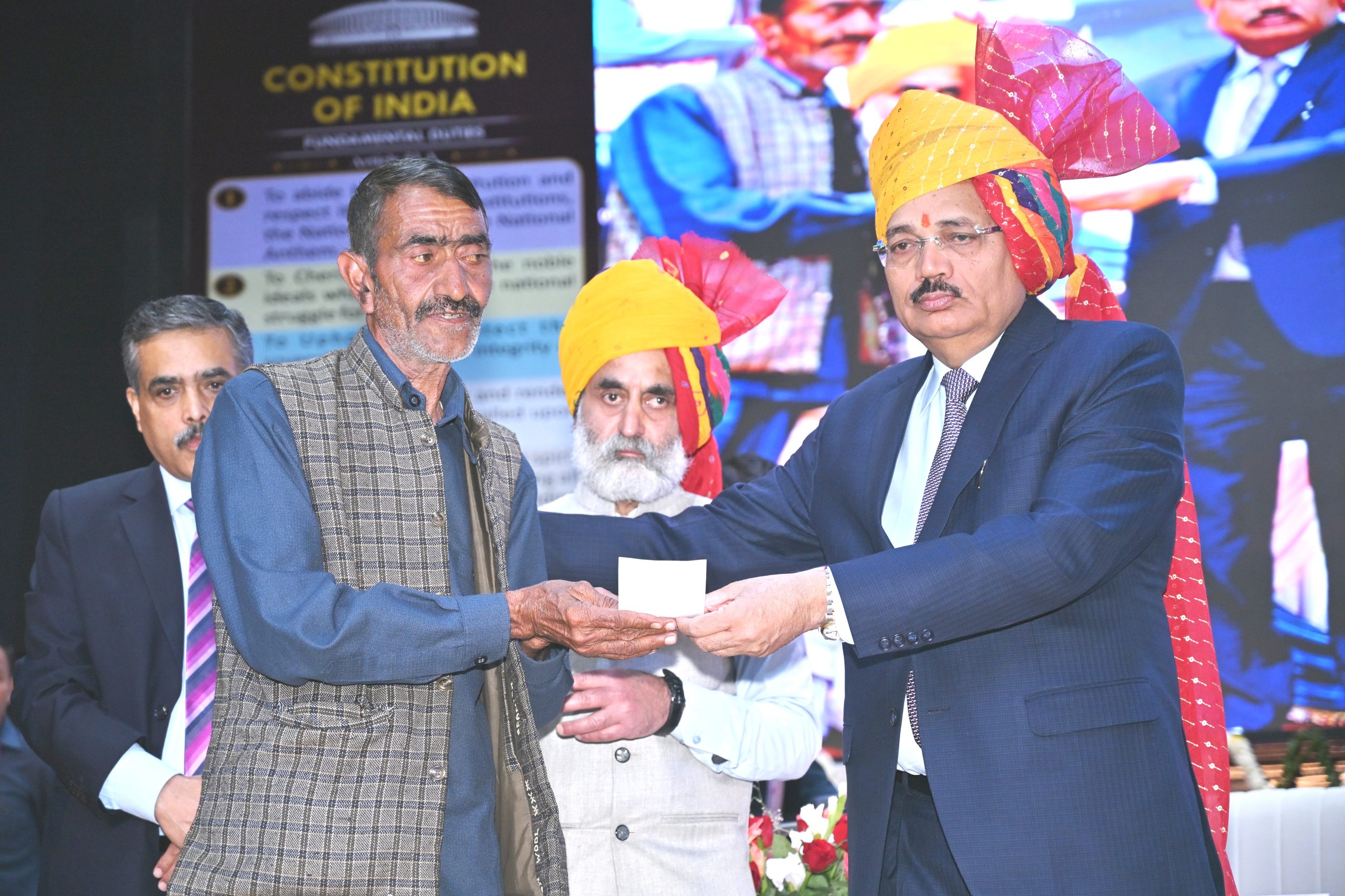 Hon’ble Mr. Justice Surya Kant, Chief Justice of India and Patron-in-Chief of NALSA, handing over a cheque of ₹50,000 to a victim of disaster of Mandi District from the Chief Justice Disaster Relief Fund as financial assistance for rehabilitation.