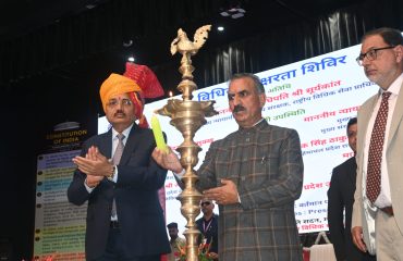 Lighting of the ceremonial lamp by the esteemed dignitaries.