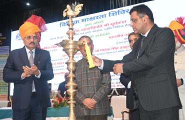 Lighting of the ceremonial lamp by the esteemed dignitaries.