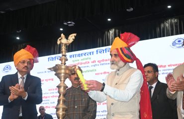 Lighting of the ceremonial lamp by the esteemed dignitaries.