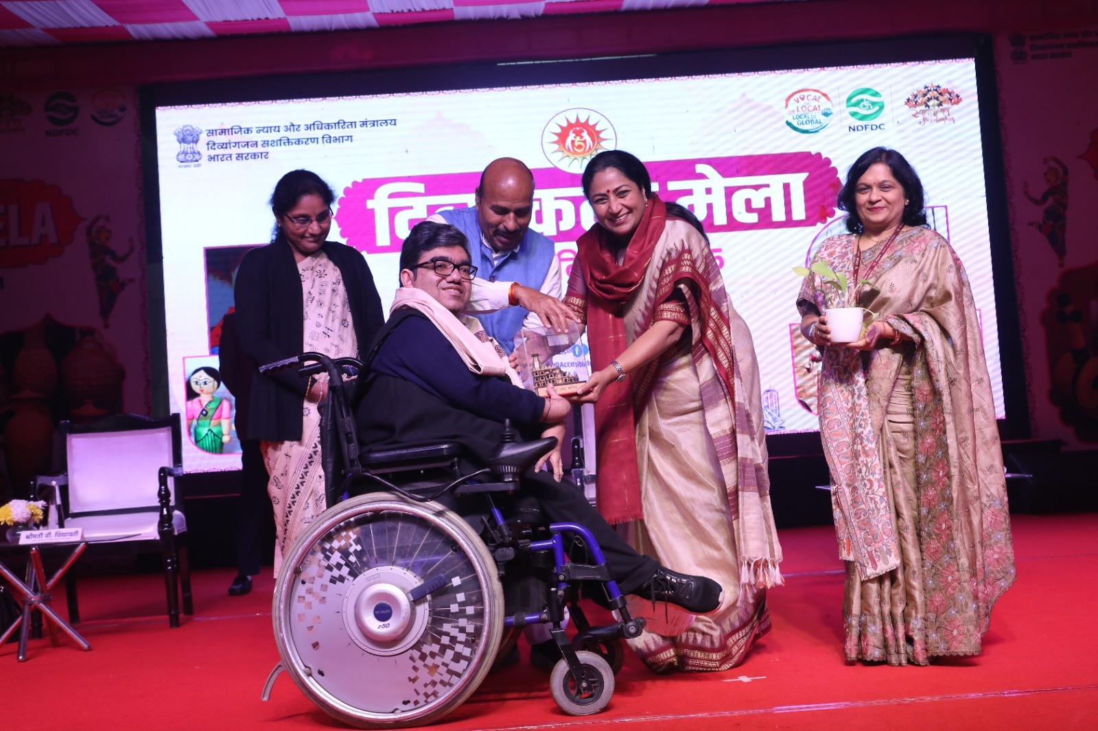 A moment of pride and possibility. The Divya Kala Mela celebrates the spirit of resilience. Smt. Rekha Gupta, the Hon'ble Chief Minister of Delhi, along with Dr. Virendra Kumar, the Hon'ble Union Minister of Social Justice and Empowerment, Smt. V. Vidhyavathi, Secretary, and Smt. Richa Shankar, DDG, honored excellence at the Divya Kala Mela on December 13, 2025, at Kartvya Path, New Delhi.