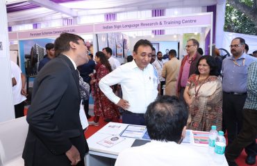 Secretary of the Department of Empowerment of Persons with Disabilities, Mr. Rajesh Aggarwal, is gathering information about a stall.