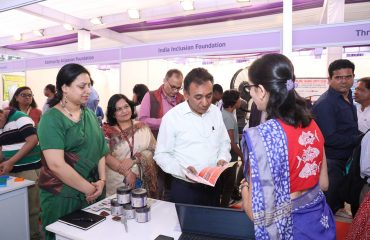 Secretary of the Department of Empowerment of Persons with Disabilities, Mr. Rajesh Aggarwal, is inspecting a stall.