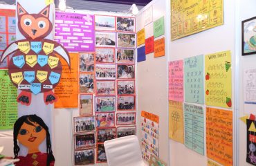 This picture is of a stall decorated with various creative posters.
