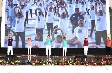 On the occasion of International Yoga Day, Yoga instructors are performing asanas at the Yoga programme held at Kanha Shanti Vanam.