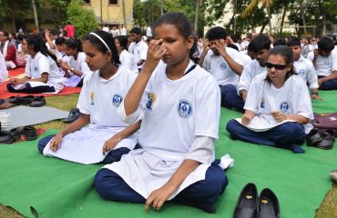 Visually impaired children are practicing pranayama at the National Institute located in Dehradun.