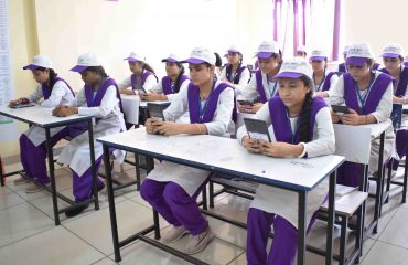 3 Distribution of tablets during classroom session.