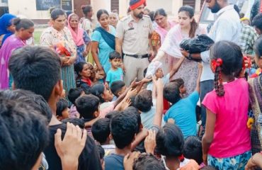 Distribution of flood relief material in a flood relief camp organized by DLSA, hsp in the flood effected area