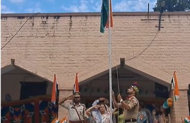 Principal District and Sessions Judge Reasi hoisting national flag on Independence day