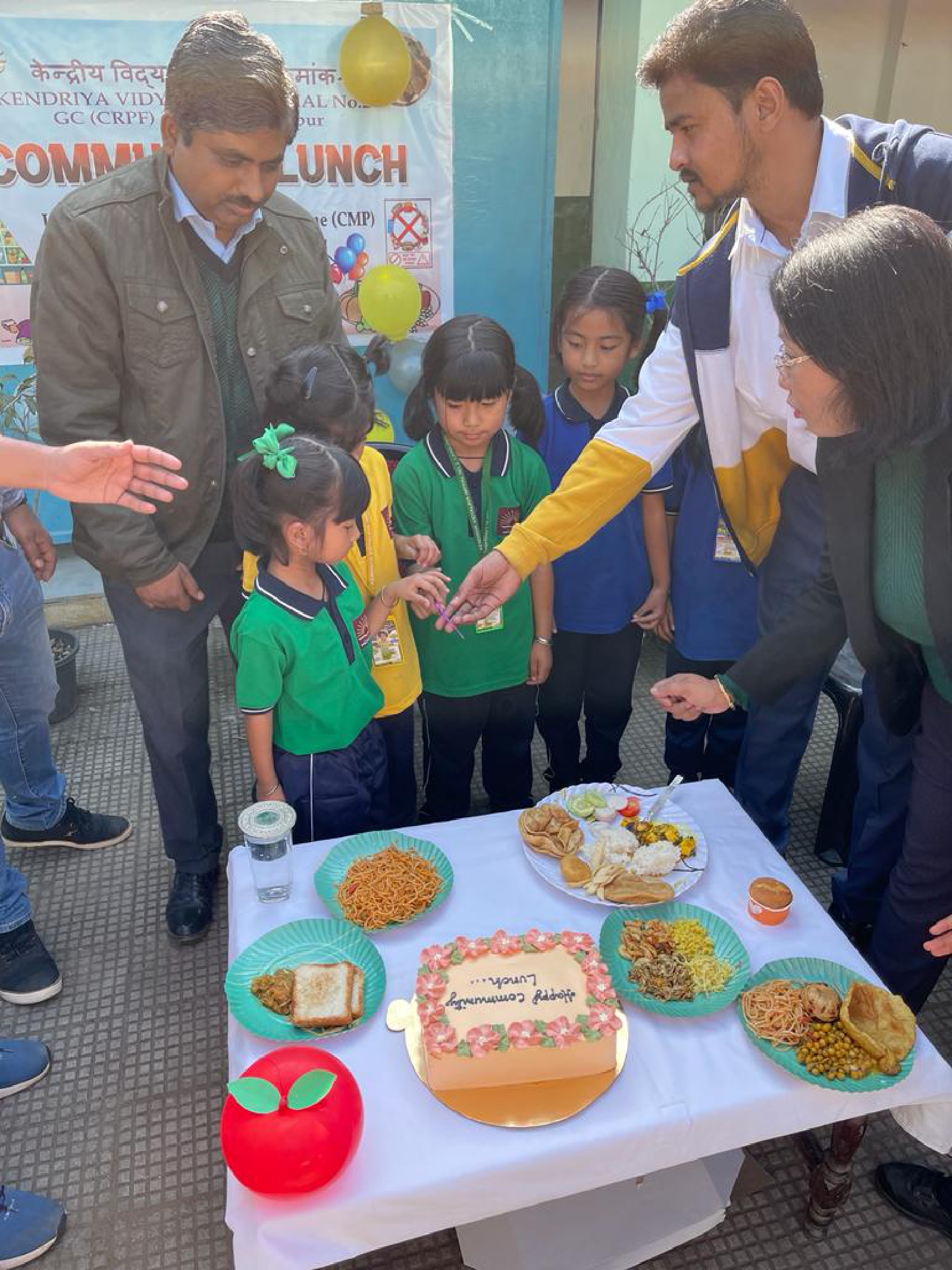 Cake cutting by tiny tots in Community Lunch Celebration In KV Imphal no 2