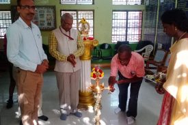 PRINCIPAL LIGHTING THE LAMP