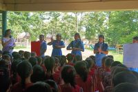 Guides demonstrating the six steps of Handwashing at KG School, NERIST.