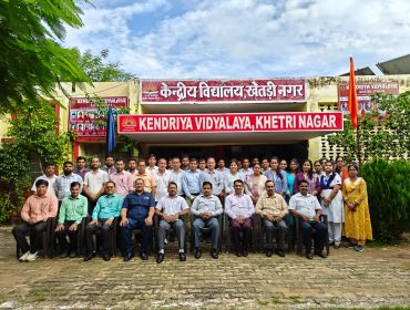 staff photo with inspecting team