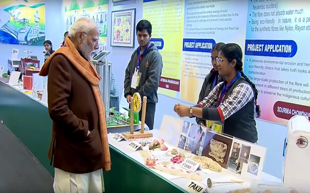 Sourima Choudhury demonstrating her project on Lotus Silk to Ho'ble Prime Minister of India