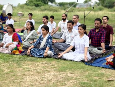 Teachers perform Yoga