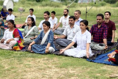 Teachers perform Yoga