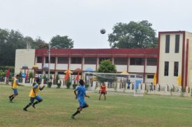 PLAYING FOOTBALL