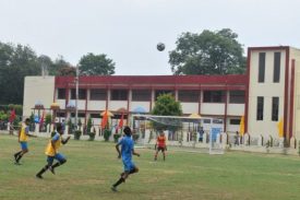 PLAYING FOOTBALL