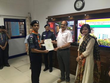 Image Showing: DC Sir is giving certificate to Scout and Guide Student