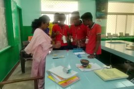 Students performing experiment