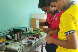 Students performing experiment in Physics lab