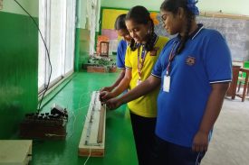 Students performing experiment