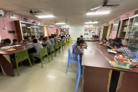 STUDENTS READING IN LIBRARY