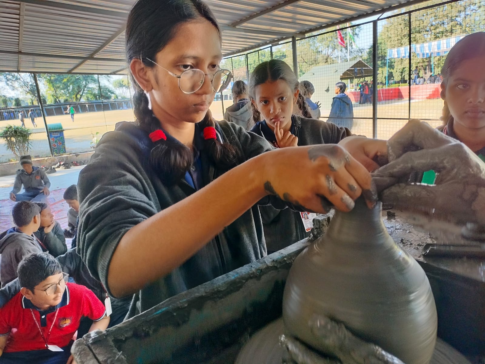 HAND-ON LEARNING OF POTTERY MAKING BY STUDENT