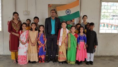 PRINCIPAL IC WITH CHILDREN ON TRADITIONAL DANCE DAY