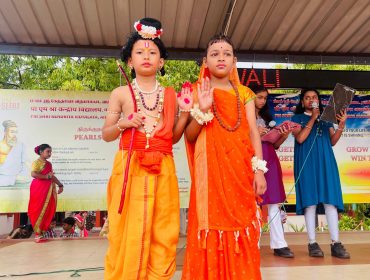 primary students performing as ram and sita gestures
