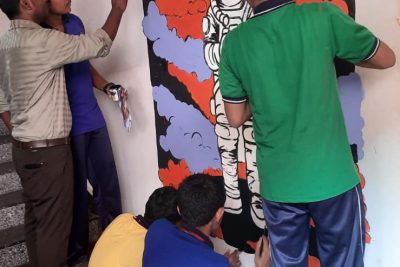 Wall painting with students