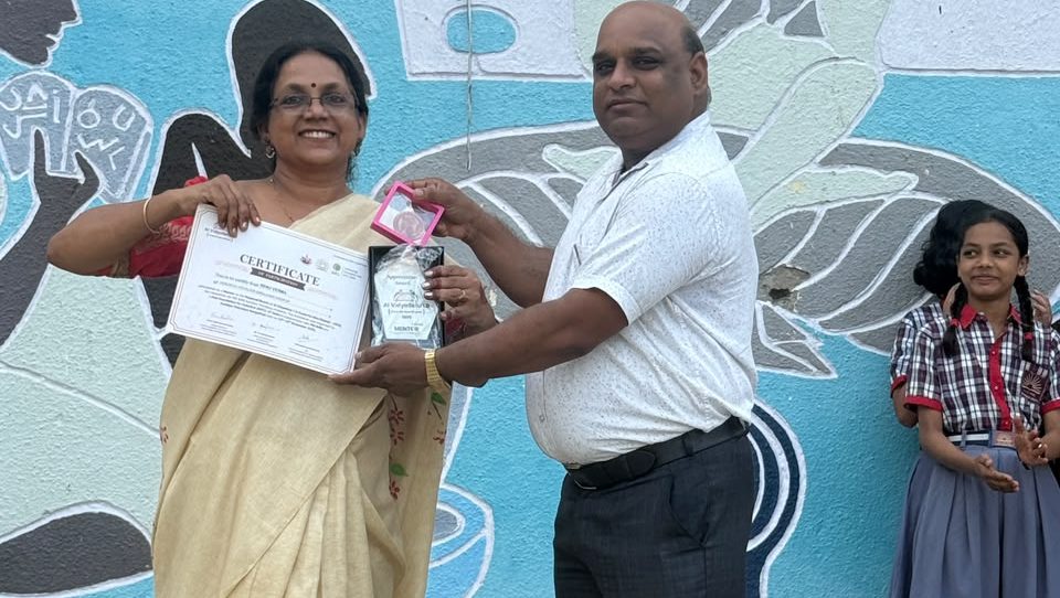 certificate with award and momento distribution to Smt. Renu Verma, TGT (WE)
