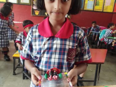 class one student with her clay toys set