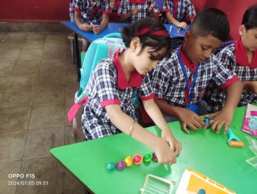 Class one students involved in clay activity