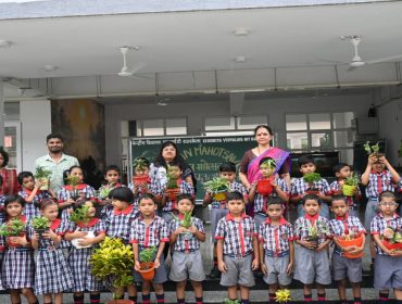 Class 1 students with palnts