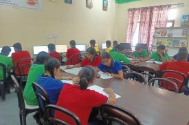 STUDENTS STUDYING IN LIBRARY