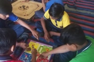 STUDENTS PLAYING LUDO